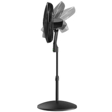 Black pedestal fan shown from the side, with angled blades behind the grille