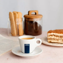Espresso cup and saucer with Lavazza pod logo