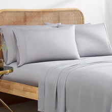 Bamboo rayon sheet set on bed with two light-gray pillowcases