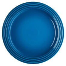 Blue round plate with ridged rim and glossy finish