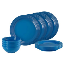 Blue dinnerware set with stacked plates and bowls
