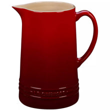 Cerise Le Creuset 1.6 qt pitcher with curved handle and pouring spout, glossy finish