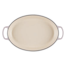 Oval baker with cream interior and dark rim, two loop handles