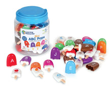 Alphabet letter pop toys in a plastic jar, with multiple letter pieces inside