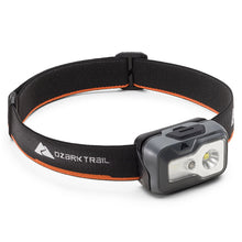 Ozark Trail LED headlamp with black strap and orange trim, gray front housing