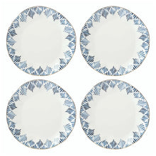 Set of four porcelain dinner plates with blue speckled border