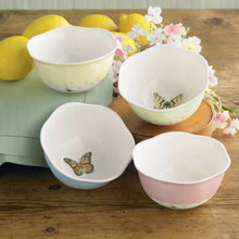 4-piece porcelain dessert bowl set with butterfly decals on pastel bowls: pale yellow, green, pink, white.
