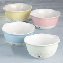 4-piece porcelain dessert bowl set with butterfly accents on pale yellow, pink, light blue, and mint bowls.