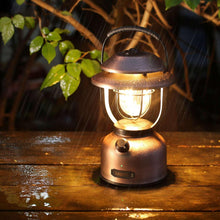 Retro metal LED rechargeable lantern glowing warm light with top handle and base