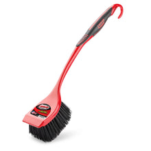 Red scrub brush with black bristles and angled square cleaning head