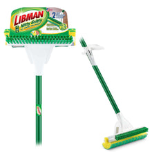 Sponge mop with scrub brush, green handle and yellow cleaning head on retail package.