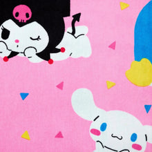Kids beach towel close-up, pink with cartoon penguin and white animal faces