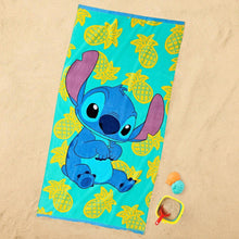 Kids beach towel in turquoise with blue Stitch character and yellow pineapple pattern