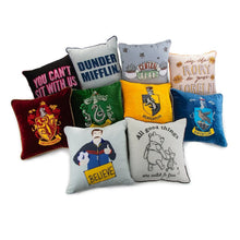 Assorted character decorative throw pillows with colorful printed designs.