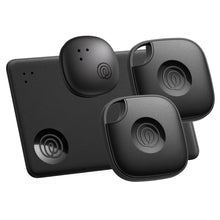 Four black Bluetooth tracker Tiles with circular logo buttons and key attachment loops