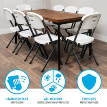 Set of white folding chairs with contoured seats, steel frame and protective foot caps