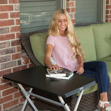 Black folding personal table with dark tabletop and gray steel frame
