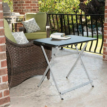 Outdoor black folding personal table with gray steel legs and dark tabletop