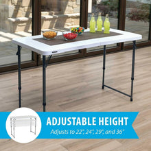 White adjustable-height folding table with black legs and tabletop for dining