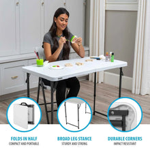 Adjustable folding table with broad, stable leg stance under a white tabletop