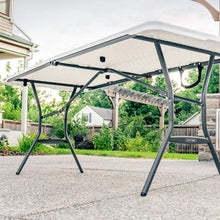 White fold-in-half table with black frame extended outdoors
