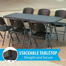 Stacking folding table with dark tabletop and metal folding legs