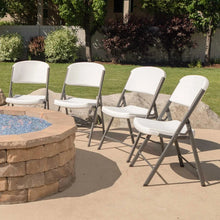 Set of light folding chairs with contoured seats and curved backs, grey metal frames