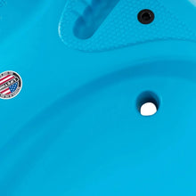 Blue kayak deck plug opening and textured surface detail.