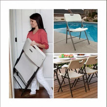 Almond folding chair with contoured seat, carried in a folded position, black frame