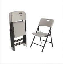Folded almond folding chair with contoured seat and back, black legs