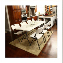 Almond folding dining chairs with contoured seats and black frames, multiple in view