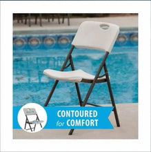 Almond folding chair with contoured seat and back, black legs