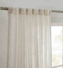 Sheer light-filtering curtain panel in white with rod pocket and textured vertical weave