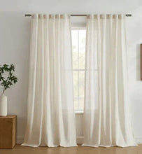 Light-filtering curtains: two white sheer panels with rod pocket and vertical pleats