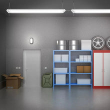 Two hanging linkable LED shop light bars with frosted diffusers