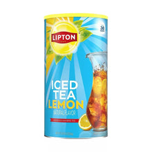 Lipton iced tea lemon mix container with glass pitcher and lemon slices