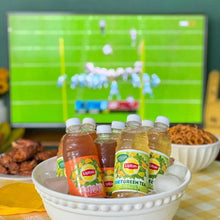 Lipton iced tea bottles in a white bowl with assorted flavors