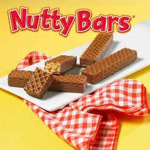 Nutty Buddy wafer bar pieces on a plate with plaid cloth