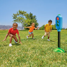 Blue traffic light play toy with red, yellow, and green lights on green base