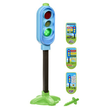 Outdoor traffic light play toy on green base with red, yellow, and green lights