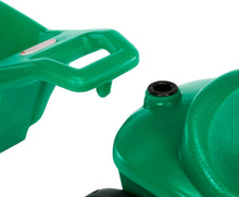 Green ride-on tractor cart attachment with handle and black wheel, close-up detail
