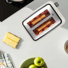 2-slice toaster interior with glowing heating elements and bread slices
