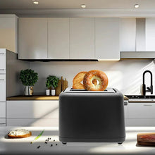 Black 2-slice toaster with bagel on top, countertop-ready design