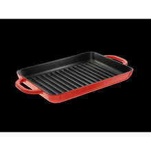 Enameled cast iron grill pan with ridged cooking surface and red side handles