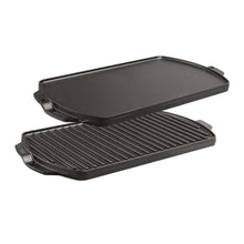 Reversible cast iron grill and griddle with smooth and ridged cooking surfaces