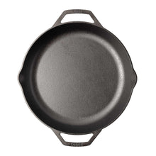 Small gray cast iron skillet with top handle and two side grips, top view