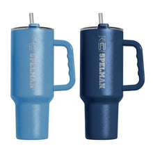 Two-color tumbler set, light blue and navy, with flip lids, straws, and handles.