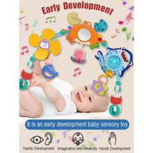 Baby sensory play arch with hanging sea and animal toys, infant reaching toward bar