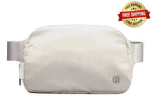 Lululemon Athletica belt bag 1L in white, front zipper and logo, with strap