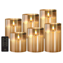 Set of 6 flameless LED pillar candles in amber glass with glowing flame, plus remote.